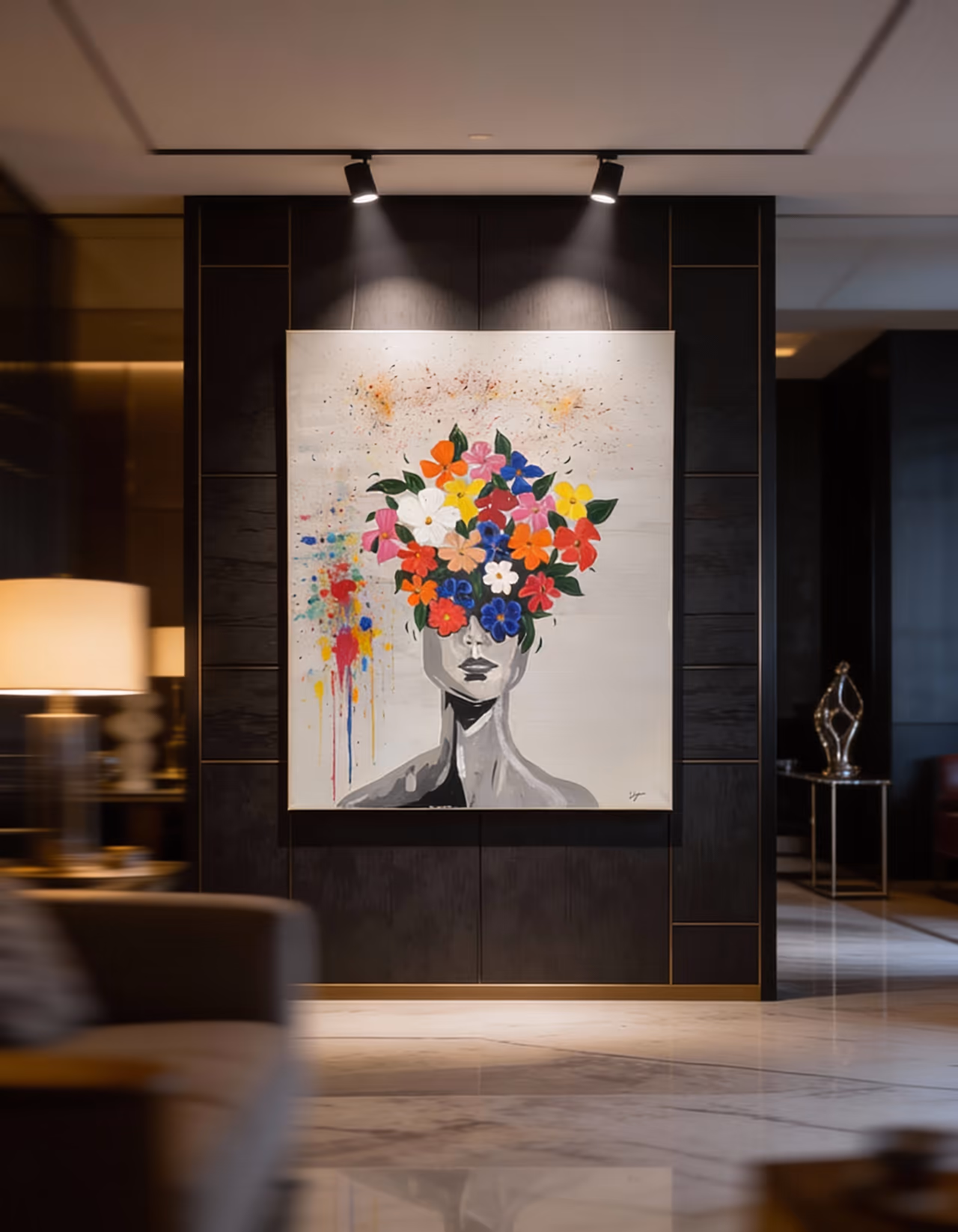 Large framed portrait on a dark panelled wall lit by two spotlights — a woman whose face is hidden by a burst of colourful flowers.